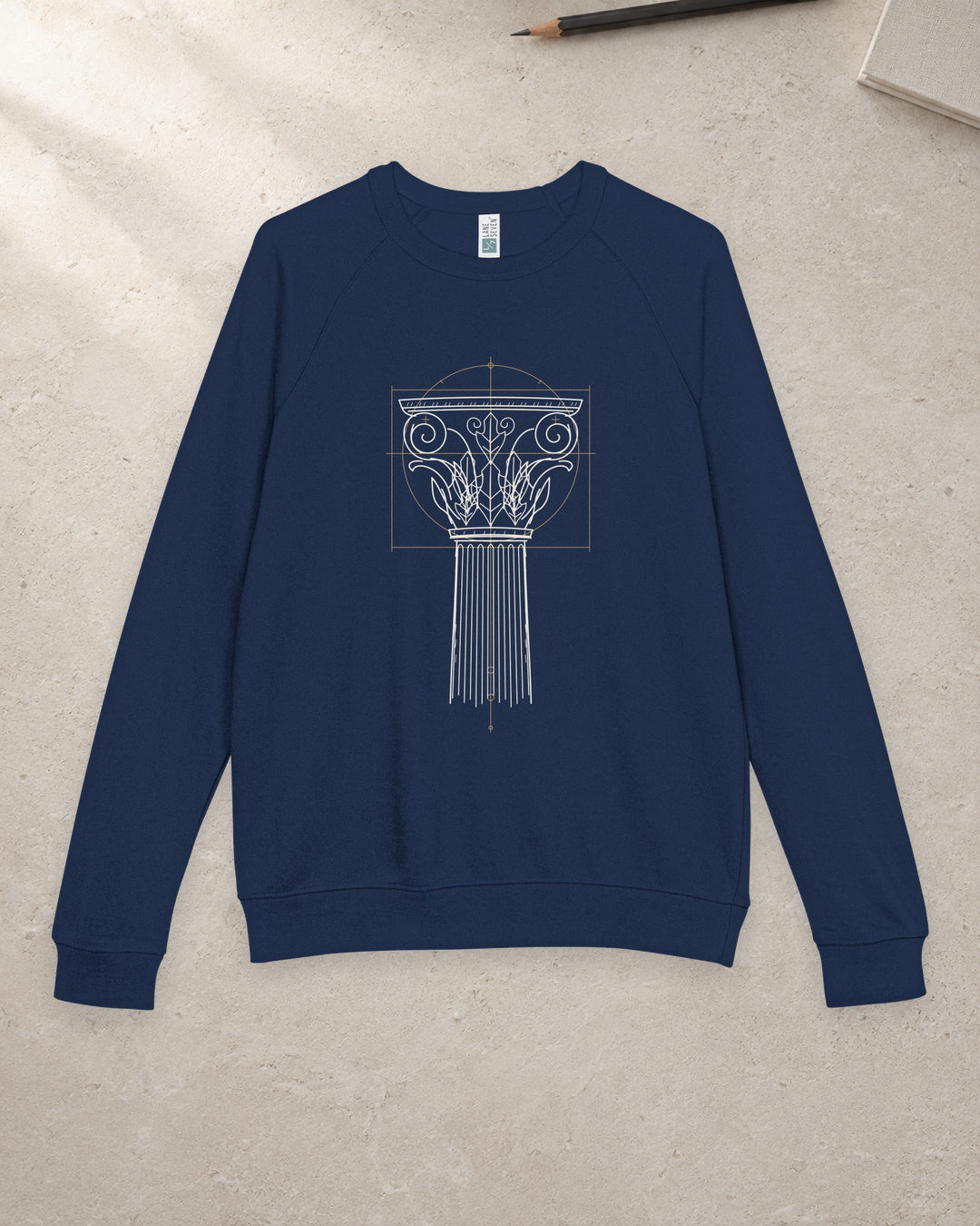 Navy Ionic Capital raglan crewneck supplier garment mockup on a generated pale tabletop background; not a photograph of a physical sample